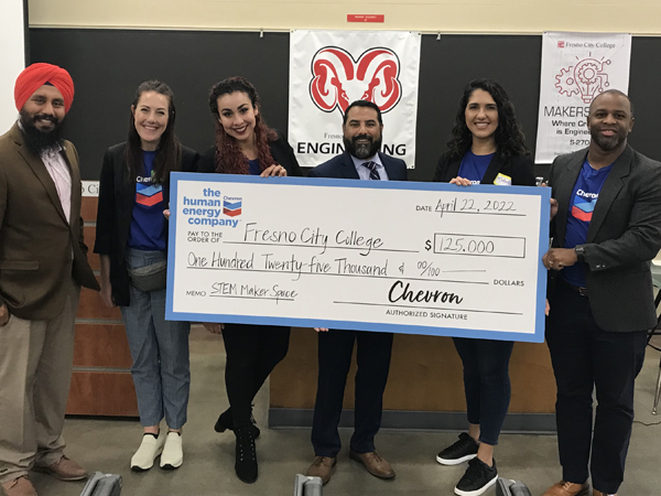 Group of people holding up check to Fresno City College